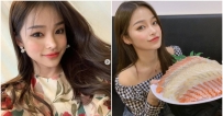 愛吃美食的個性正妹小巧臉蛋和手上大盤生魚片成對比